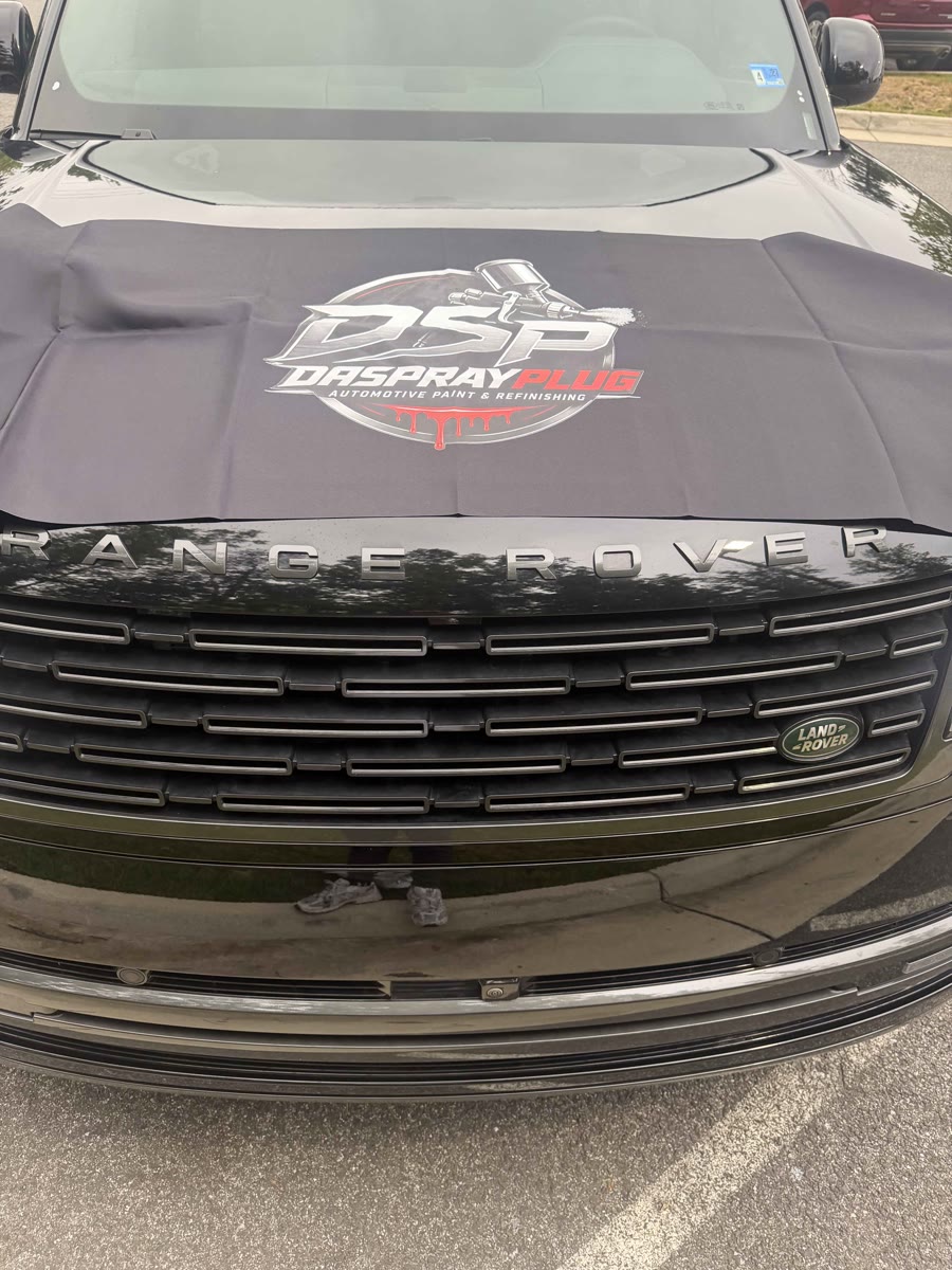 DSP-branded cover on a Range Rover, refinishing work for the dealership